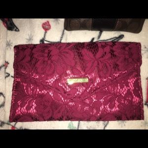 small maroon laced purse